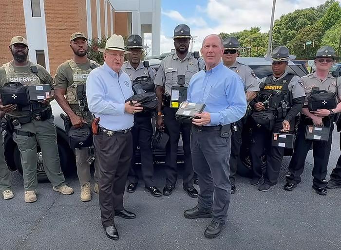 Foundation representatives and Sheriff David Davis with donated safety equipment